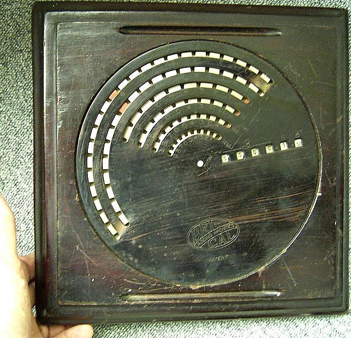 British Calculators BriCal Early Model 19cm Diameter in Wood Plate source: V. Geppert
